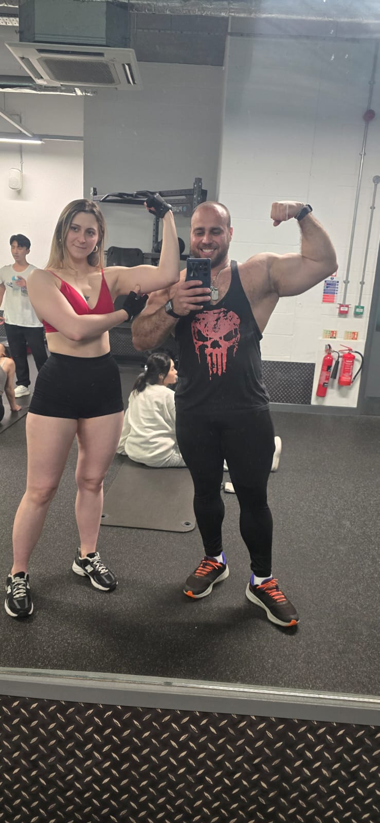 Client flexing during a weekly check-in selfie